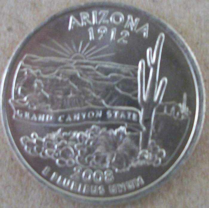 2nd variety has the extra leaf covering part of the designers initials. It is real similar to the 1st picture only this one does not have the leaf covering part of the date.