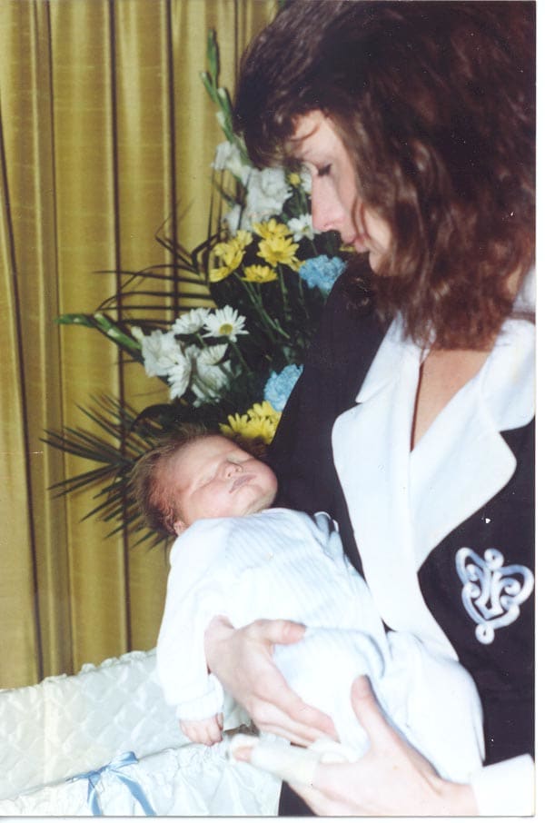"TracyAndZachariahAtFuneral" by Tracy Scheide Marciniak - National Right to Life Committee. Tracy Marciniak, holds the body of her son Zachariah. Ms. Marciniak was seriously injured, and Zachariah was killed, by an assault at nine months gestation.