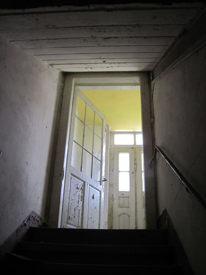 Old houses settling can make doors appear to open or close on their own, or creak when opening or closing