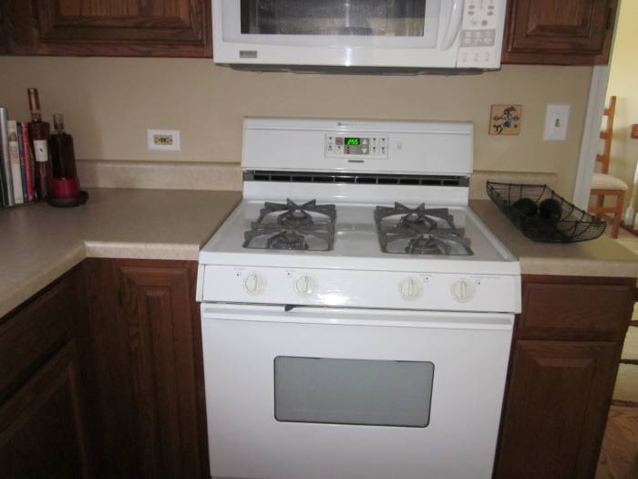 Stove remains centered under microwave even though it and the cabinet on the right of it needed to be moved slightly.