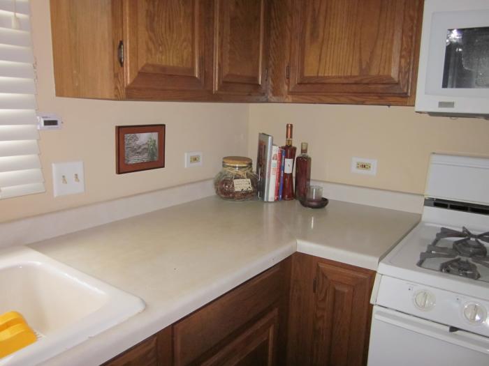 and has a tear just above the drawer to the right of the sink. That happened when I opened the drawer and a meat thermometer popped out. Before I could stop myself the tip got caught under the lip of the counter edge and make a tear. Ugh!