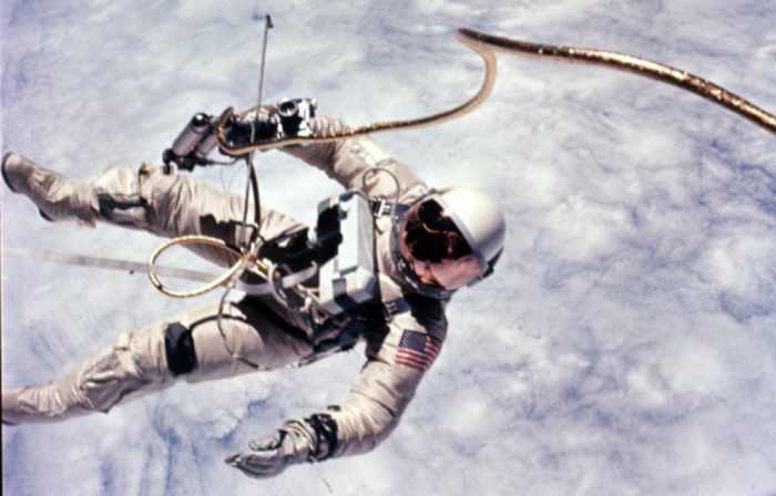 Ed White makes America's first spacewalk. The VCM is mounted on White's chest. The Hand-held Maneuvering Unit (described below) is in his right hand. Photo courtesy of NASA.