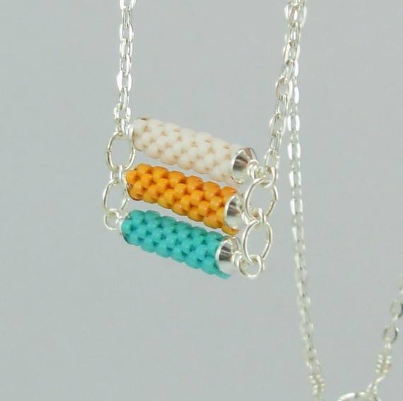 3 tier Beadwoven necklace in turquoise, orange and white: Combine several beaded beads with wire work to create stunning pieces like this one.