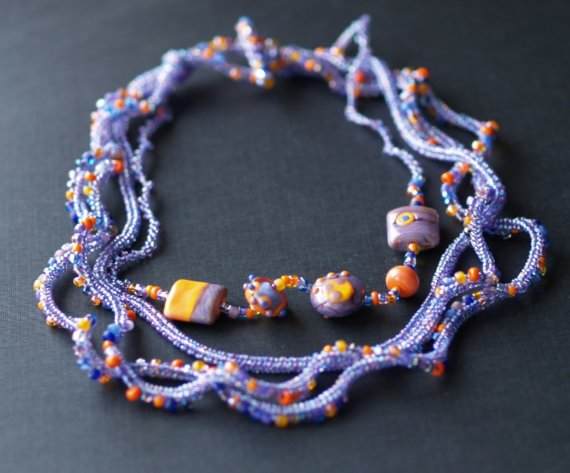 Over the Moon Necklace: MaryLou uses different sized seed beads as well as lamp work focals to create this stunning necklace.