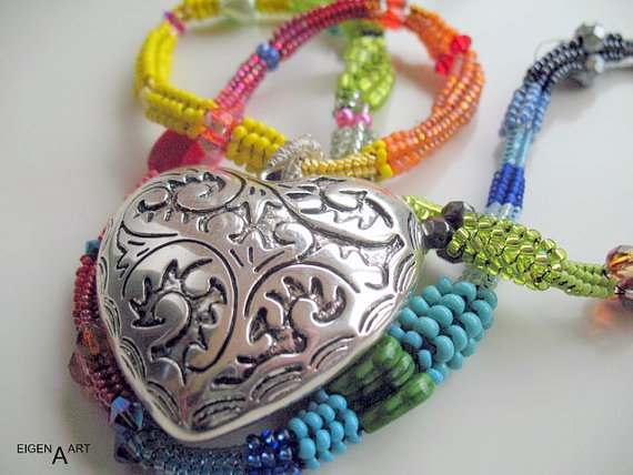 Colourful herringbone necklace with a silver heart: This necklaces contains different sized seed beads as well as a silver heart focal.