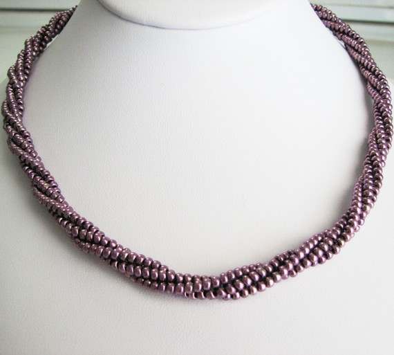 Beaded Rope Wrap in Eggplant: This piece can be wore as a necklace or wrapped as a bracelet.