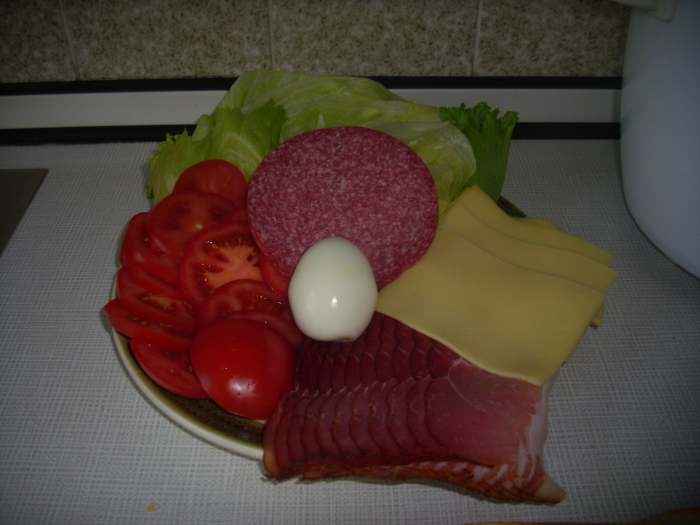 Endive Salad leaves, Tomatoes, Salamis, Gouda Cheeses and Schwarzwälder (Black Forest Ham)