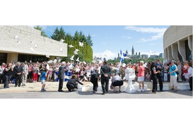 Sixty-one doves are released at the Museum of Civilization in Gatineau on Thursday after the hearse bearing the casket of NDP Leader Jack Layton brought the body of the Quebec-born politician back to his home province one last time.