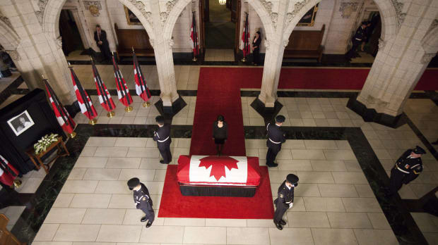 Olivia Chow, wife of NDP Leader Jack Layton, approaches her husband's casket as he lies in state in the foyer of the House of Commons in Ottawa, Wednesday Aug. 24, 2011.