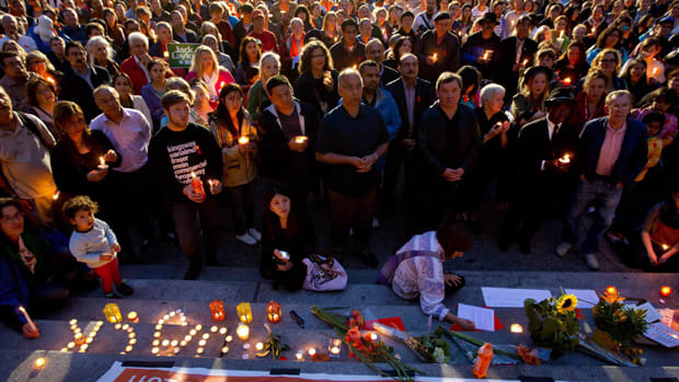 Hundreds of people gather for a candlelight vigil to remember late NDP leader Jack Layton in Vancouver, B.C., on Monday, August 22, 2011.