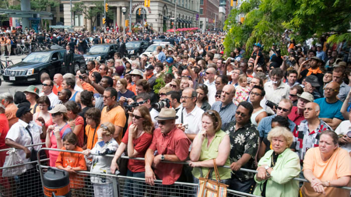 People crowd outside Roy Thomson Hall ahead of funeral services for NDP leader Jack Layton in Toronto on Saturday, Aug. 27, 2011.
