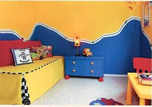This room is pretty simple on the theme with lots of bright colors that can be reused when the child switches interests. The walls are amazing though!