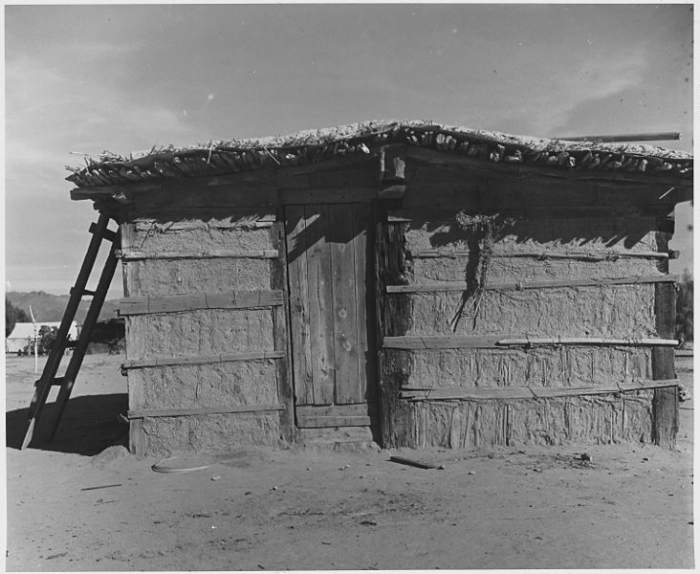 Cortaro Cotton Farms in Pinal County; Yaqui Indian "Jacal". Agricultural workers lived in huts made of mud, cactus, and mesquite timbers. Old dwellings photographed in 1940, but in use for decades.