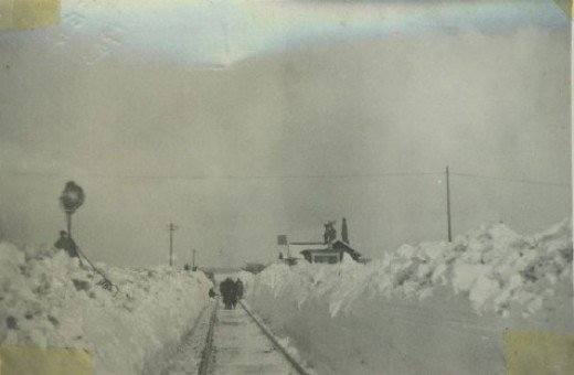 The crossing keeper's cottage, Battersby seen from the Kildale (eastern) end of the station, the single-storey cottage almost invisible under mountains of snow - the early square board signal is clearly visible