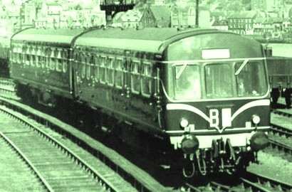 An early Metro-Cammell diesel multiple unit with 'speed whiskers' leaves Whitby Town station for the Esk Valley. Livery was initially Brunswick Green lined in cream, later with yellow panels around the route describer (code) box below the windscreen