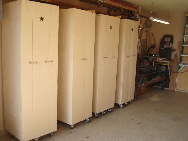 4 cabinets. Three are tri-fold used mostly for accessory storage and one is bi-fold for power tool storage.