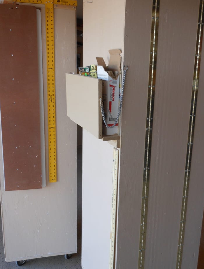 Note the piano hinges connecting the 3 sections of this tri-fold cabinet. I also added a sandpaper storage rack on the side of one cabinet.