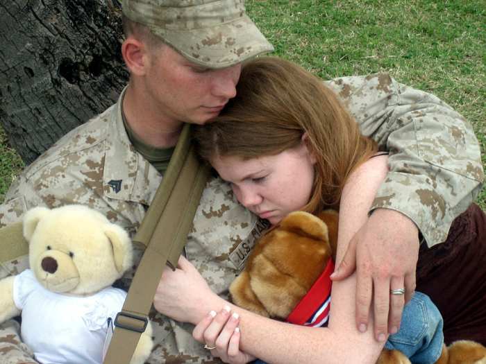 Cpl. Tyler Cobaley, an armory custodian for Lima Company, 3rd Battalion, 3rd Marine Regiment, spends a few moments with his wife under a tree at Marine Corps Base Kaneohe Bay, Hawaii, before saying‘good-bye’ to his wife, Patricia, and deploying.