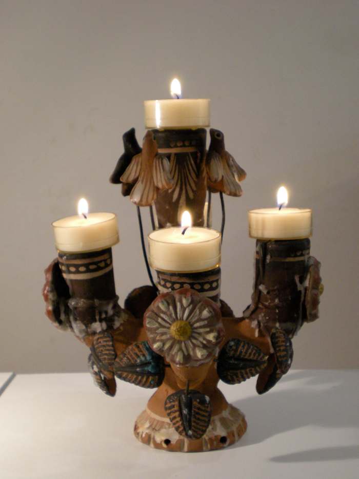 Ceiba del Mar from Mexico. Fire represents spiritual spark that animates the clay of material forms.
