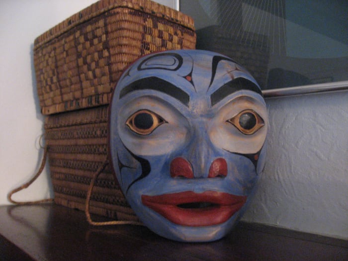 My second mask carved down and redone with background of old first nations cedar baskets