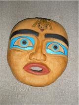 My very first carving-a flat mask made from yellow cedar and roughly carved, but I loved it.