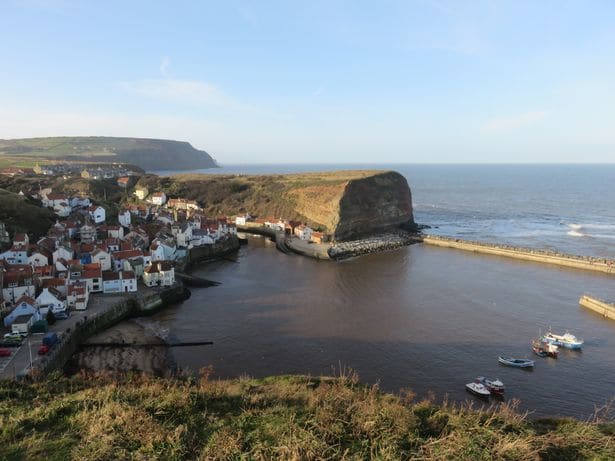 A look back to Staithes from the south on the way to Runswick Bay - this view demonstrates the power of the North Sea waves, shortly after Cook's death on Hawaii a freak wave severed the end of Cat Nab behind Mr Sanderson's shop near the road end