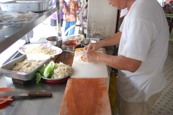 Fresh spring rolls or popiah is a popular food found in most coffee shops or eating places in Malaysia and Singapore.