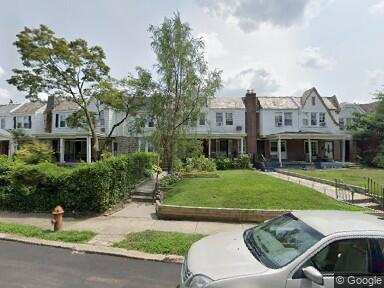 The row house to the right of the hedge is where we lived in Philly. To the far right you can see the Iroquois Apartments.