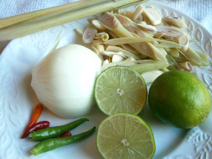 The necessary ingredients for Tom Yum soup--Thai chilies, lemon, lemon grass, garlic , onion and kaffir leaves (shown in the next picture).