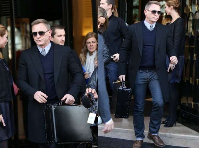 Classic hairstyle, sunglasses, shirt, tie, jumper, coat, nice jeans, dark brown shoes and a black briefcase - Daniel Craig ticks all the boxes in looking like a rich gentleman that he really is.