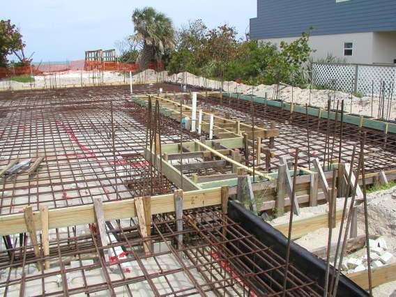 This photo is showing the steel reinforcement for a concrete slab and foundation to be laid together, now this is definitely not a do it yourself job, but it is here to show you how things are done in the building industry, you need an approved plan.