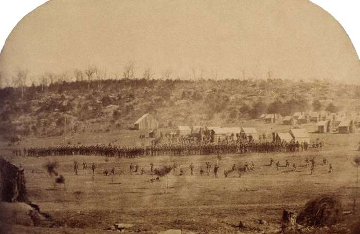 Photo of a Skirmish Drill. The dispersed troops in the foreground are the Skirmishers. The Line of Battle behind them is the remaining eight or so Companies of the Battalion