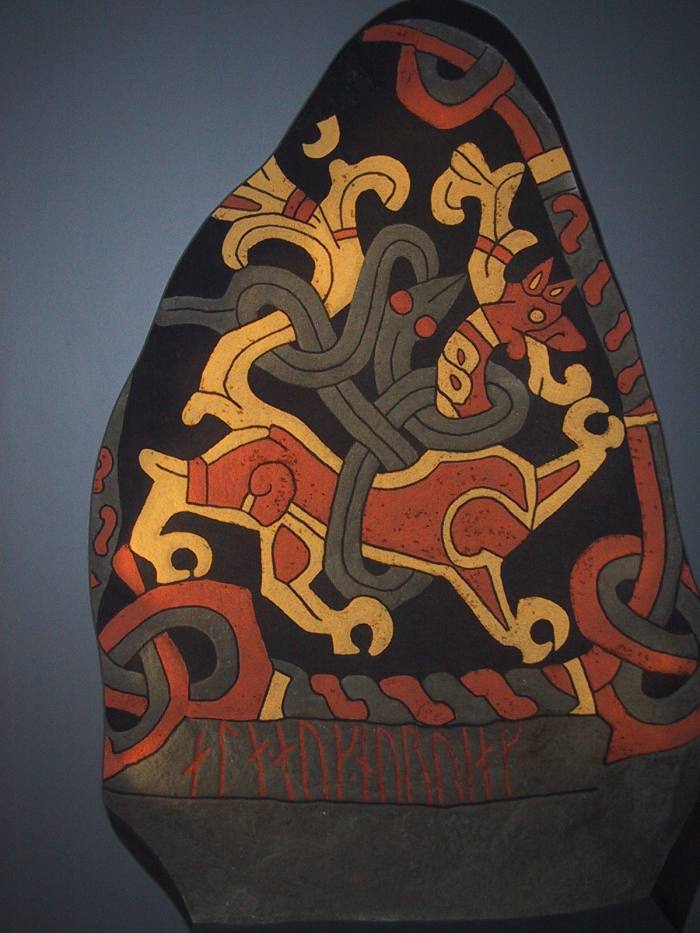 This colourful "lion and snake" scene is from a reproduction of Gormsson's rune stone, painted in the bright colours that would have featured on the original.