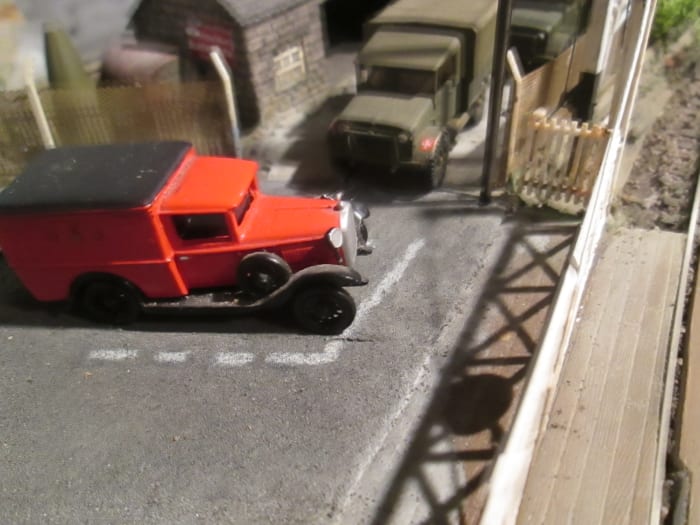 A level crossing might feature, look at period pictures for warning signs - what kind, where - and check out the vehicles in traffic, waiting to cross or passing over