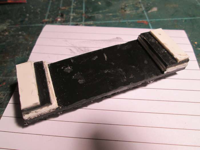 ... And the underside, the plastic strip built up to sit on the hopper slope inside the wagon.