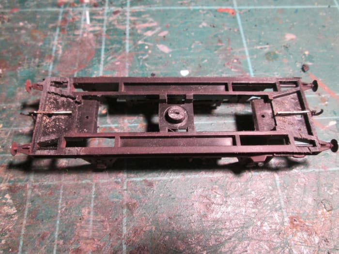 The underframe unit with the coupling shafts in place - cut centrally at the ends to accommodate the coupling shaft. Make the cut very slightly wider than the brass etch. File the tops level with the underframe 'ridge'