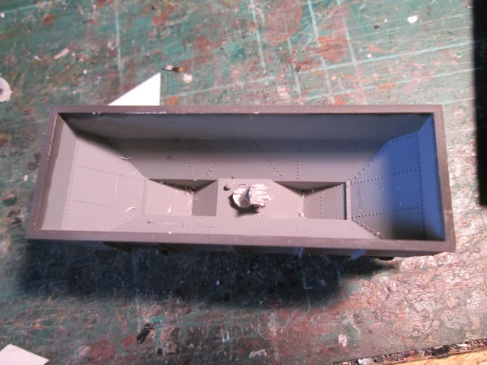 This extrusion can be eliminated in seconds with side cutters, although strictly speaking it's not necessary. The 'wedge' would cover it easily. It's your choice....