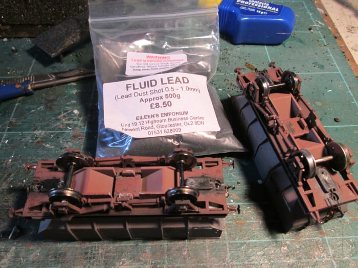 'Fluid lead' in a 500 g bag from Eileen's Emporium - lead shot, the same as you get in a shotgun cartridge! Better than steel ingots because you can 'pour' it into a small space, whereas you'd have to saw the ingot or make-weight