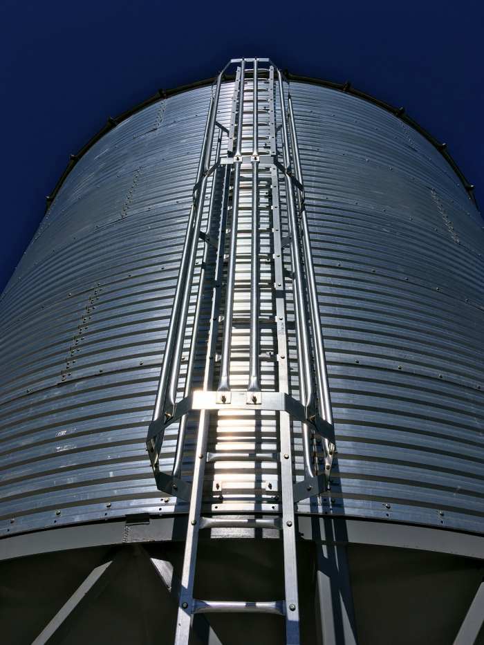This cage is partially installed on a bin on which the walls are 18 feet high, plus the hopper and peak.