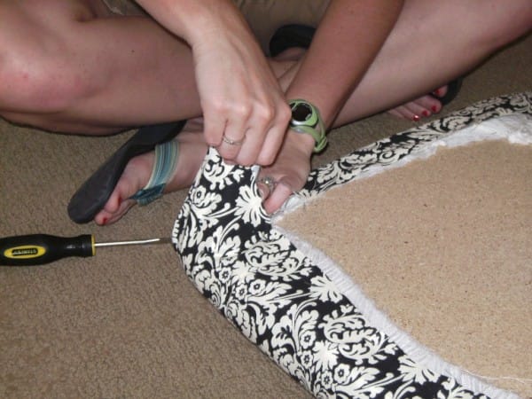 Making the corners look smooth is the hardest part of upholstering the cushion, so be patient and don't get frustrated. You'll figure it out.