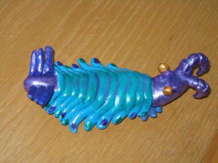 This is a clay model I sculpted of an Anomalocaris and painted with the color scheme of a Peacock Praying Mantis Shrimp.
