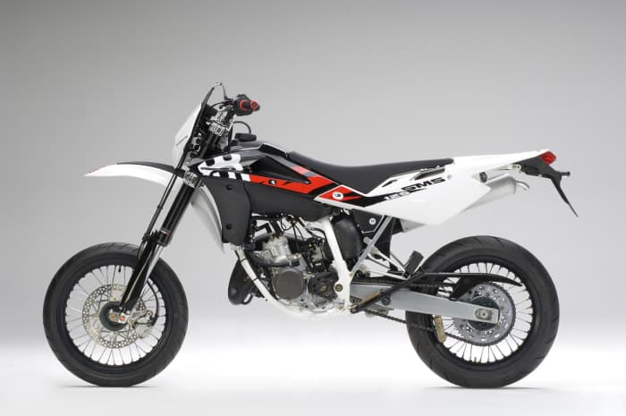 The outrageous 2009 Husqvarna SM125: Add about a thousand dollars, shop around, and you can drive home on a 2009 Harley Davidson Sportster. Is anyone crazy enough to actually buy this thing at this price?
