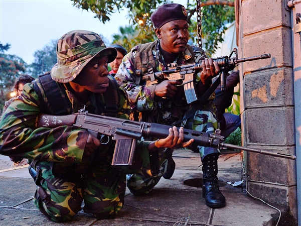 Gunmen stormed a crowded shopping mall frequented by Westerners in brazen midday attack