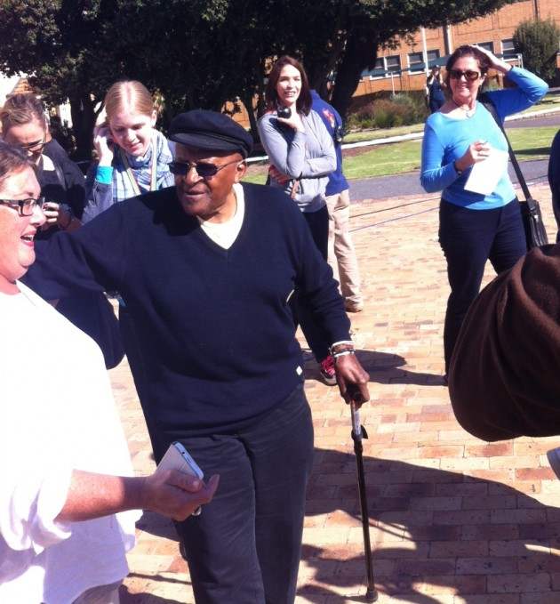 Anglican Archbishop Desmond Tutu and his wife Leah were ushered to the front of a long queue at the Milnerton High School today – but fellow voters in the seaside Cape Town suburb didn’t seem to mind. Tutu (82) was barely recognisable without his pur
