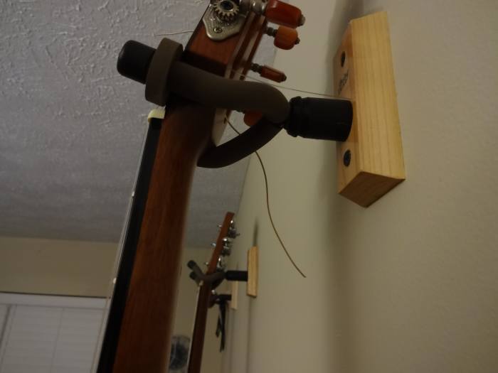 Hanging guitars may be better for the neck than sitting on a stand or laying in a case. Then there's the convenience.