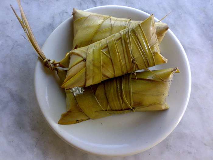 ibos -- a variety of suman -- from rice sticky cooked with sugar and coconut milk covered with coconut leaves