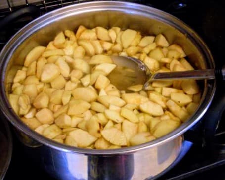 Prepare a sugar-water syrup of 1:3 (one part sugar to 3 parts water), enough to just cover apples. Cook 5 minutes, to shrink apples slightly.