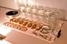 Meanwhile, check jars for nicks, cracks, and other problems. Do not use jars that are damaged. Wash in hot, soapy water. Scald if necessary (may use dish washer to clean and sterilize). Wash lids and rings.