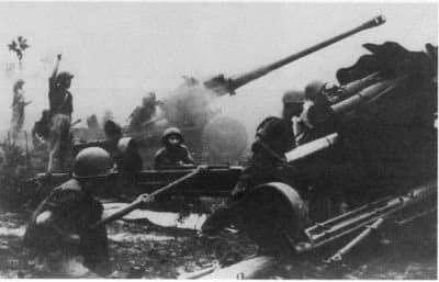 North Vietnamese artillery pounds ARVN positions during the 1972 Easter Offensive. The 130 mm towed field gun had a range of 30 kilometers and played a major role during the offensive.