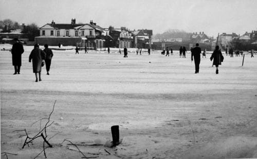 Residents walking upon the frozen Thames during the "Great Freeze" of 1962-63, January 24, 1963. Image courtesy Royal Windsor Website.com.